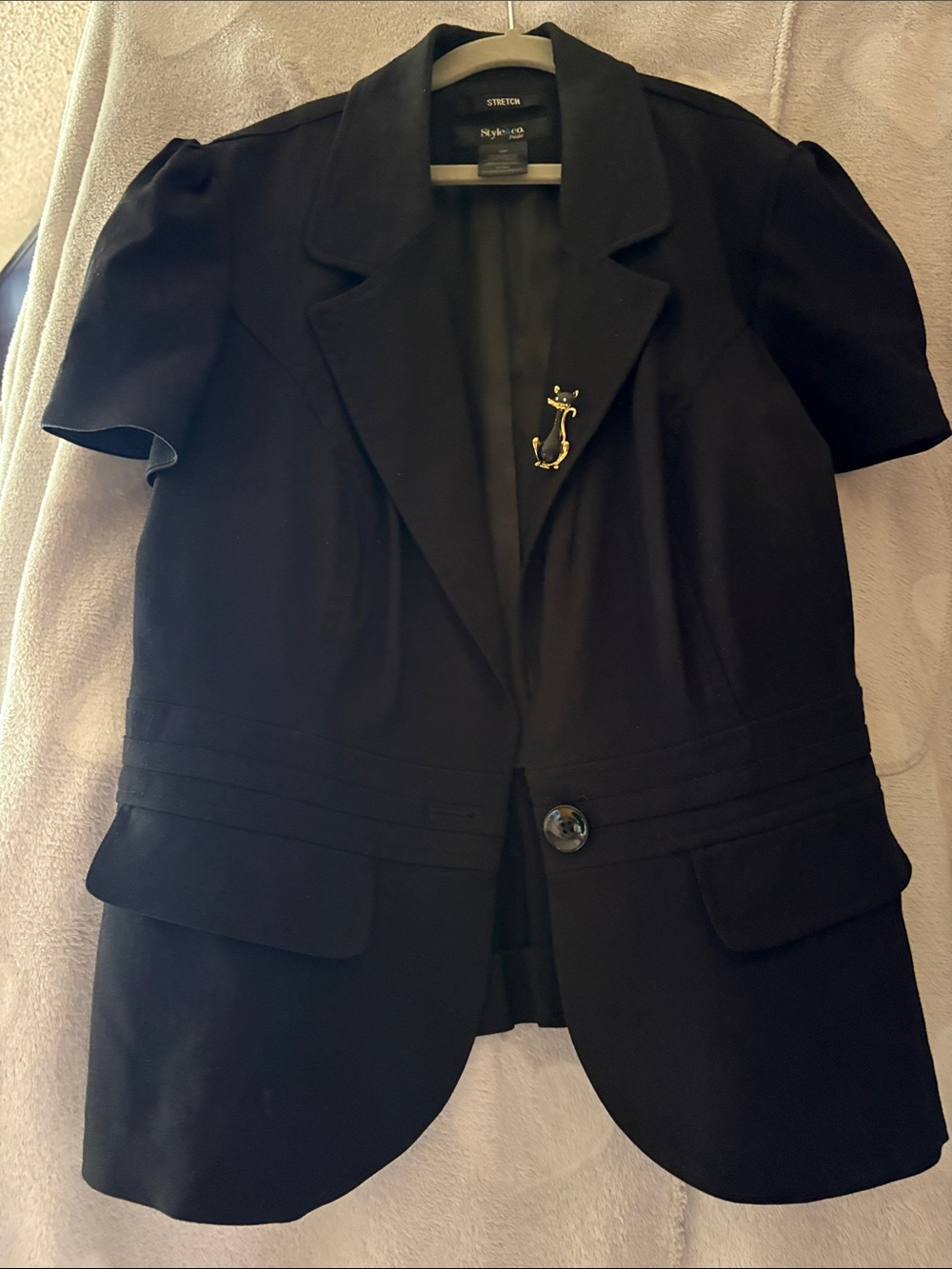 Jacket with black cat broach